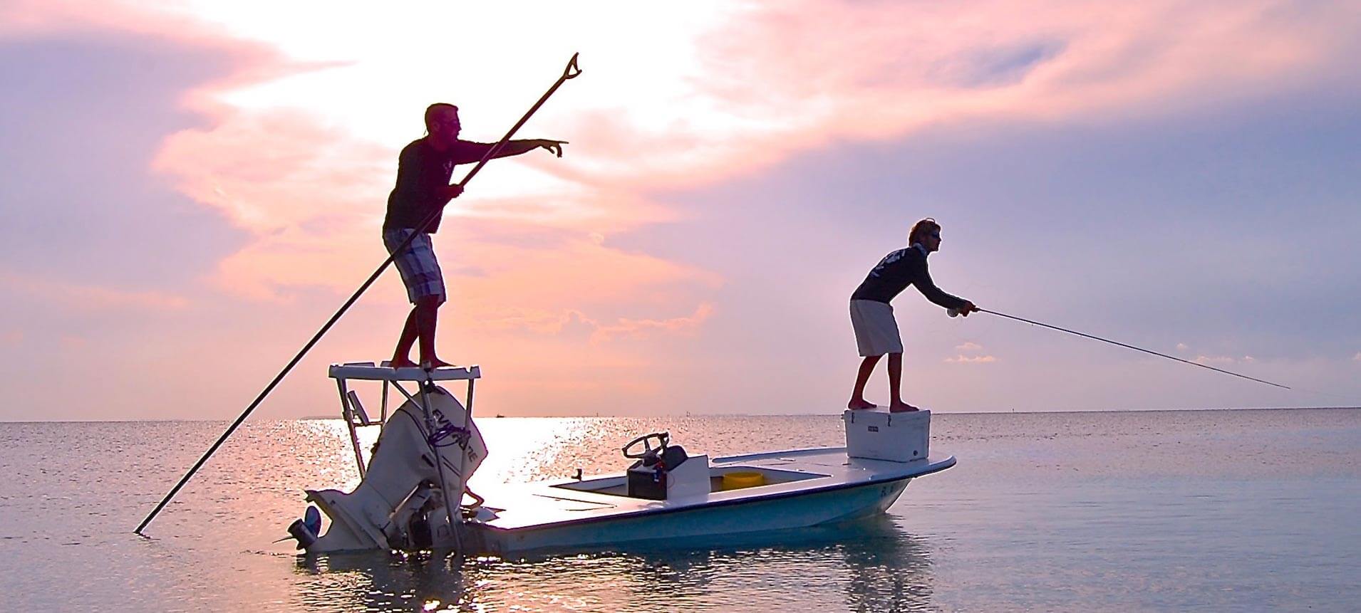 Skiff on calm water at sunset